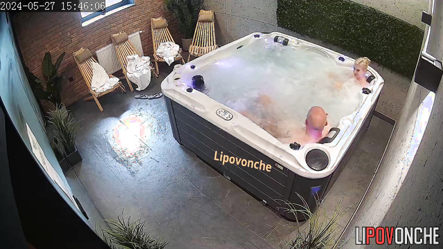 The couple took off their robes and began relaxing in the jacuzzi naked