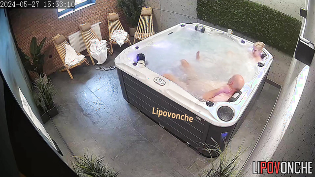 The couple took off their robes and began relaxing in the jacuzzi naked