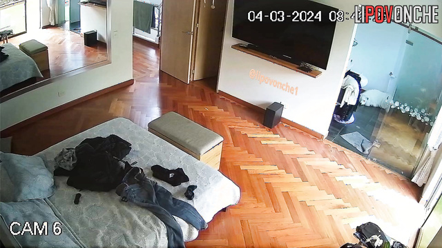 A hidden camera installed in the bedroom captured an attractive naked girl