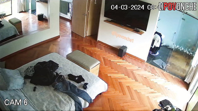 A hidden camera installed in the bedroom captured an attractive naked girl