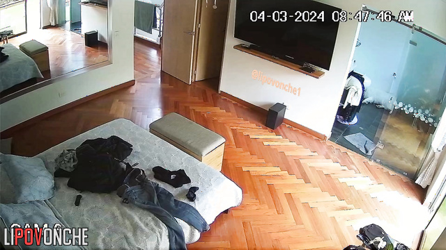 A hidden camera installed in the bedroom captured an attractive naked girl
