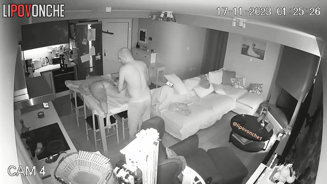 During a massage, a bald man plays with his naked wife's delicate labia