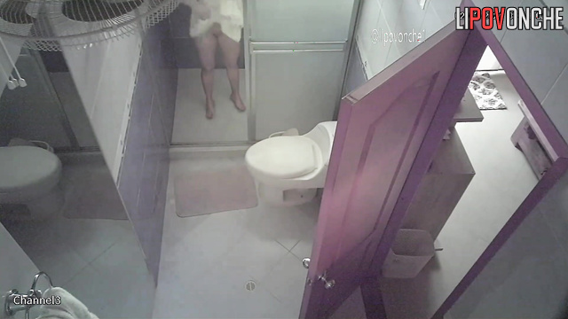 A slender blonde seductively undresses before taking a shower