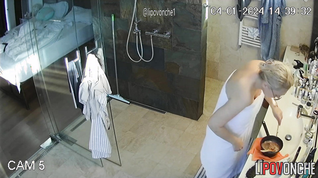 A gorgeous milf isn't shy about walking around naked in front of her fat girlfriend