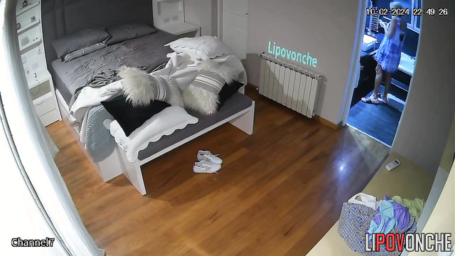 An older man and his blonde wife are fooling around and having sex in bed