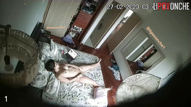 A brunette undresses in front of the mirror before a steamy masturbation session