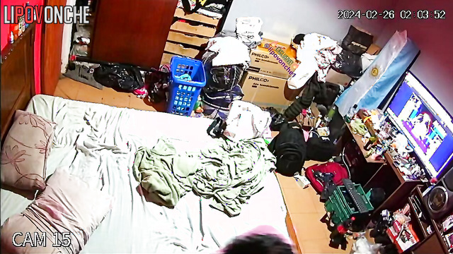 An older man watches a video on his phone while his hot wife gives him a blowjob