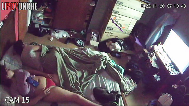 A curvy brunette in sexy red panties prefers to sleep with the TV on