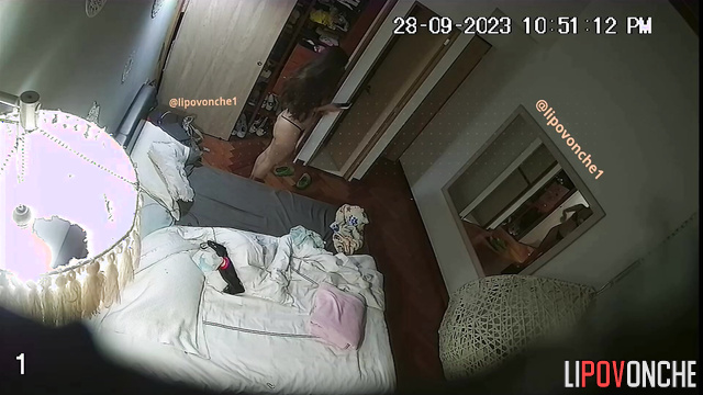 Beautiful brunette dancing naked near mirror in bedroom