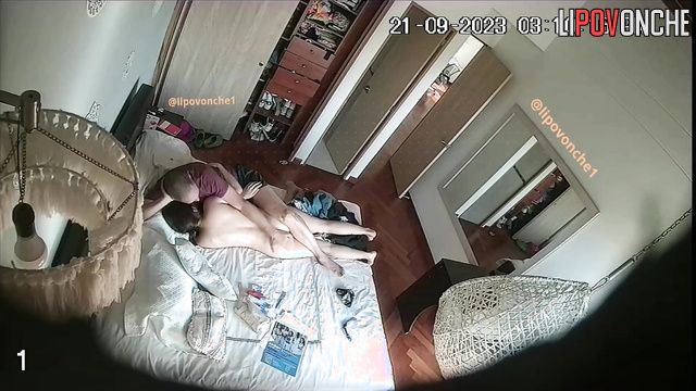 Man tenderly caresses skinny brunette on bed in bedroom