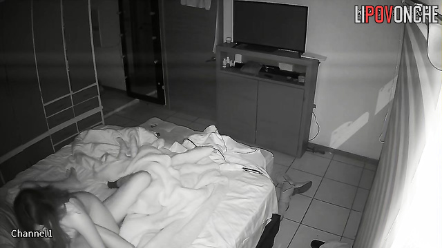 The sly wife crept up under the covers to her husband's erect dick