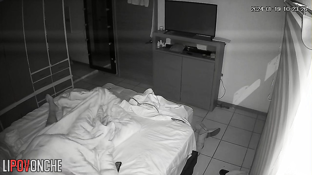 The sly wife crept up under the covers to her husband's erect dick
