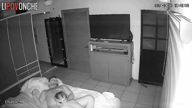 An aroused husband tries to pull the nightgown off his sleeping wife