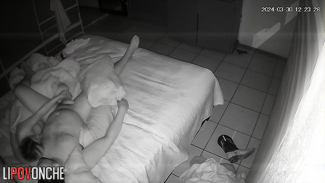 A young blonde gently plays with her sleeping husband's big cock and balls