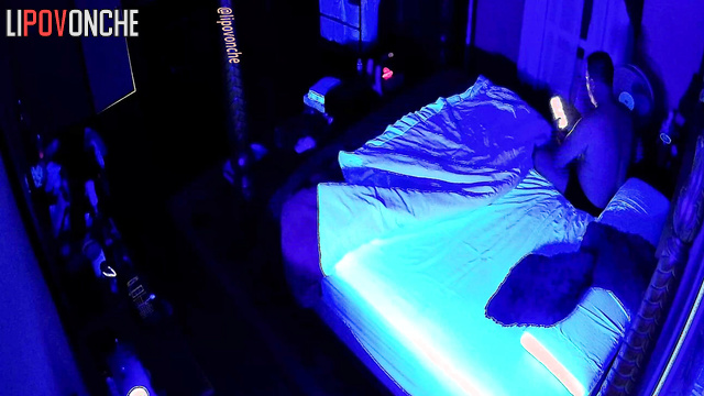 A redheaded cutie with bare breasts gets into bed with her husband