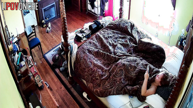 A sleepy redheaded cutie with bare breasts tries to wake up early in the morning
