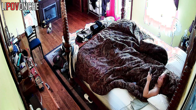 A sleepy redheaded cutie with bare breasts tries to wake up early in the morning