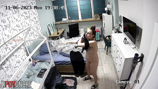 A sexy mommy with beautiful, firm breasts is getting dressed to go to the office