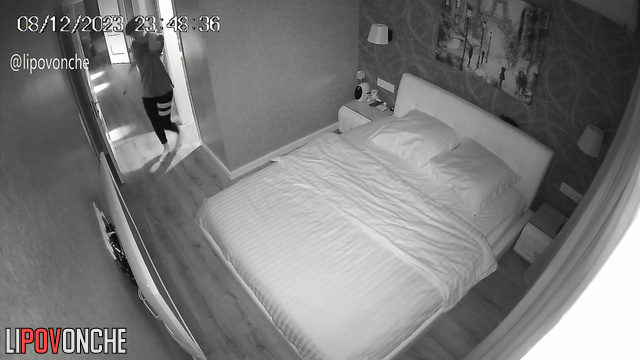 A skinny brunette admires her seductive body with interest before going to bed