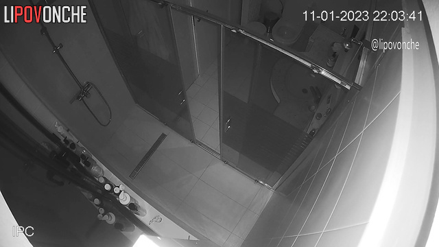 A sleepy woman, completely naked, walks into the toilet