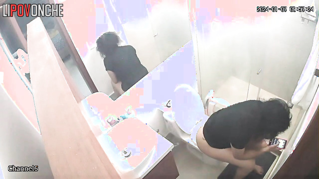 A compilation of videos featuring a sexy curly-haired brunette using the restroom