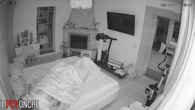 The husband playfully nibbles his wife's soft buttocks as he pulls down her panties