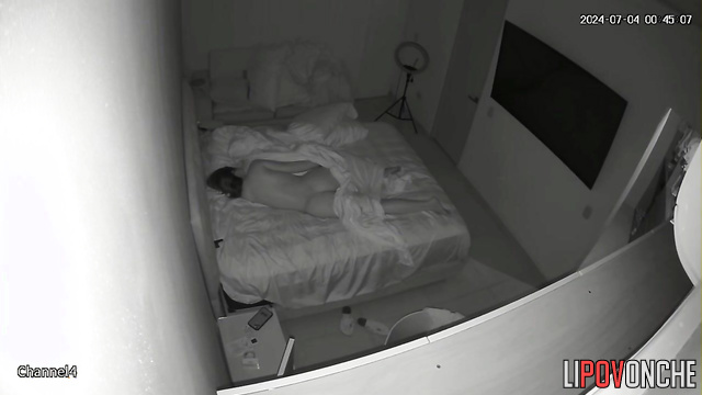 A sexy beauty with a seductive, firm ass sleeps completely naked