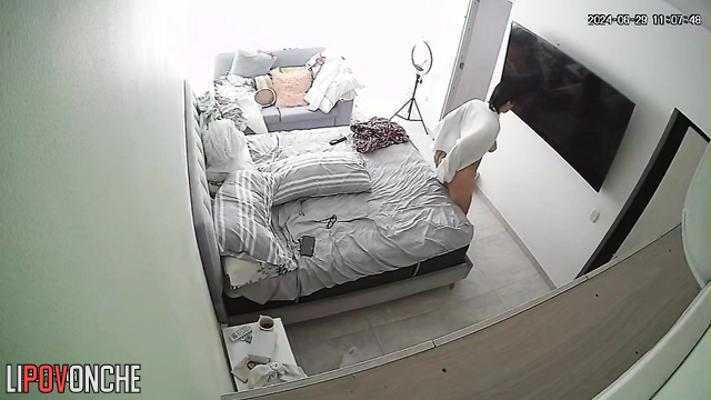 After her shower, the curvaceous brunette freshened up and relaxed naked in bed
