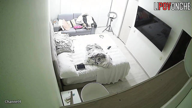 A cutie with a sexy ass seductively undresses while waiting for her lover