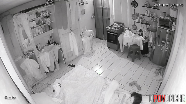 A bored brunette strokes her clitoris under the covers while watching porn