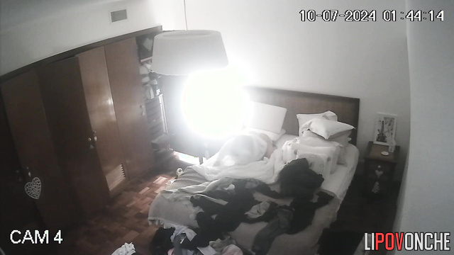 An excited blonde attaches a dildo to the pillow to get more pleasure