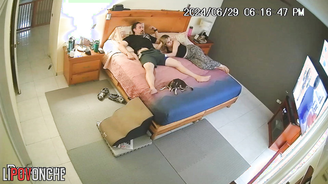 A seductive girl plays with her bored husband's penis under her shorts