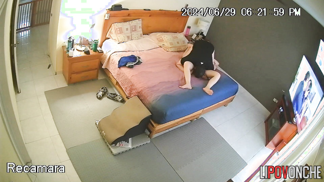 A seductive girl plays with her bored husband's penis under her shorts