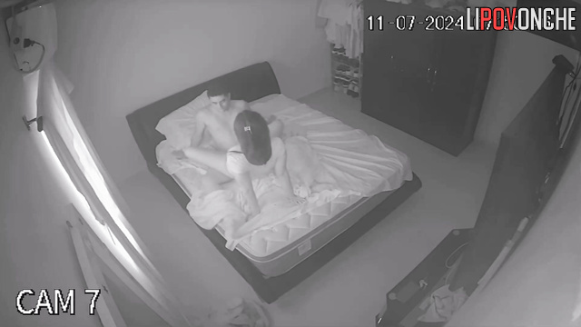 An aroused husband tries to press his cock against his sleeping wife's ass