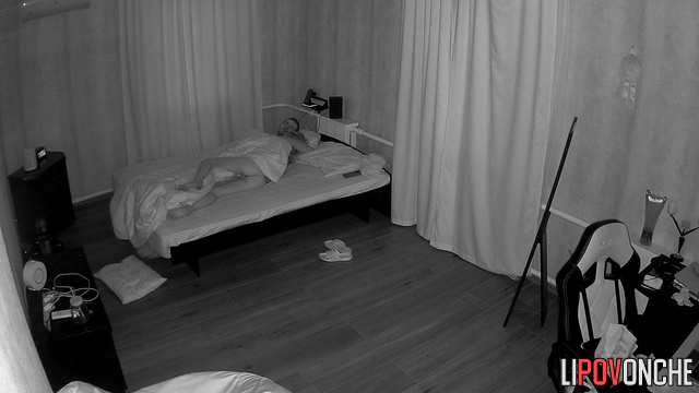 A skinny girl sleeping in bed showed her toned, naked butt to the camera