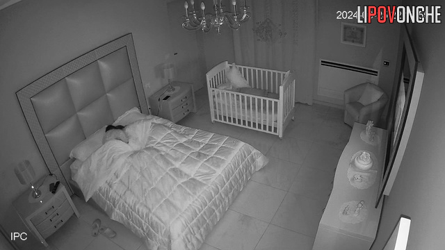 Late at night, sleepy wife manually brings her aroused husband to orgasm