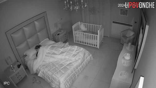 Late at night, sleepy wife manually brings her aroused husband to orgasm