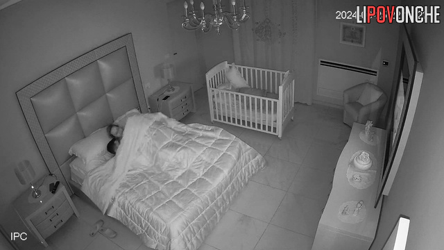 Late at night, sleepy wife manually brings her aroused husband to orgasm