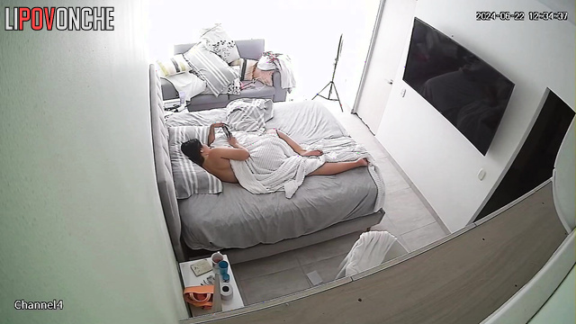 Her husband is spying on her with a hidden camera