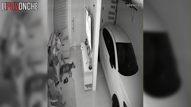 Couple watching tv together / and at this moment they are being watched