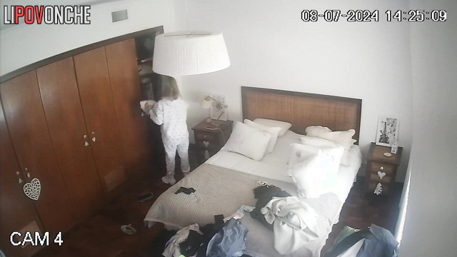 Beauty blonde walking around the room and being watched
