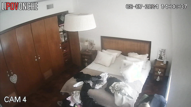 Beauty blonde walking around the room and being watched