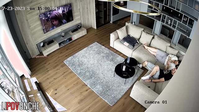 Couple kissed sweetly and then started watching TV
