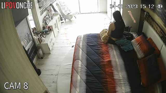Spouses enjoying an evening of leisure in a cozy bedroom