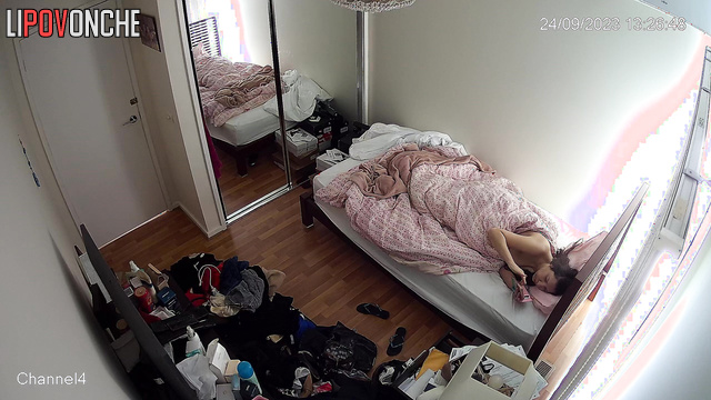 Brunette was lying in bed and scratching her butt