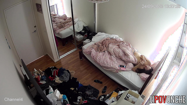 Brunette was lying in bed and scratching her butt