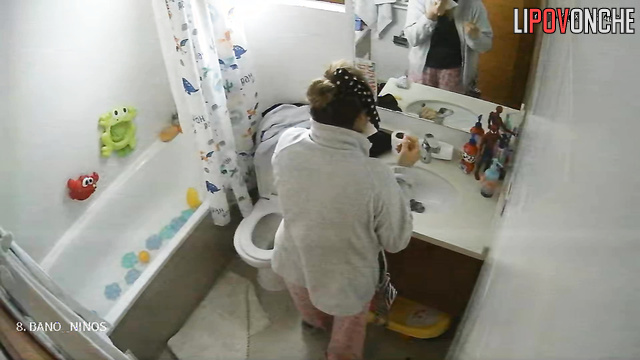Her habit is to sit on the toilet and text, spy cam