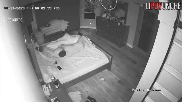 Couple drinking red wine in bed - spy home camera