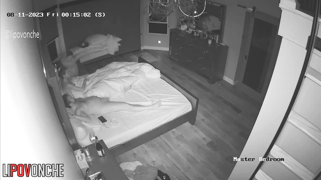 Couple drinking red wine in bed - spy home camera
