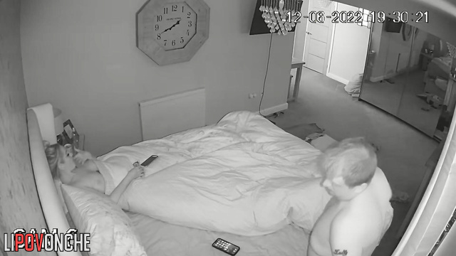 Tired woman relaxes in bed and touches small dick of her hubby